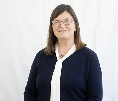 A professional portrait of Jane Darling with a white background.